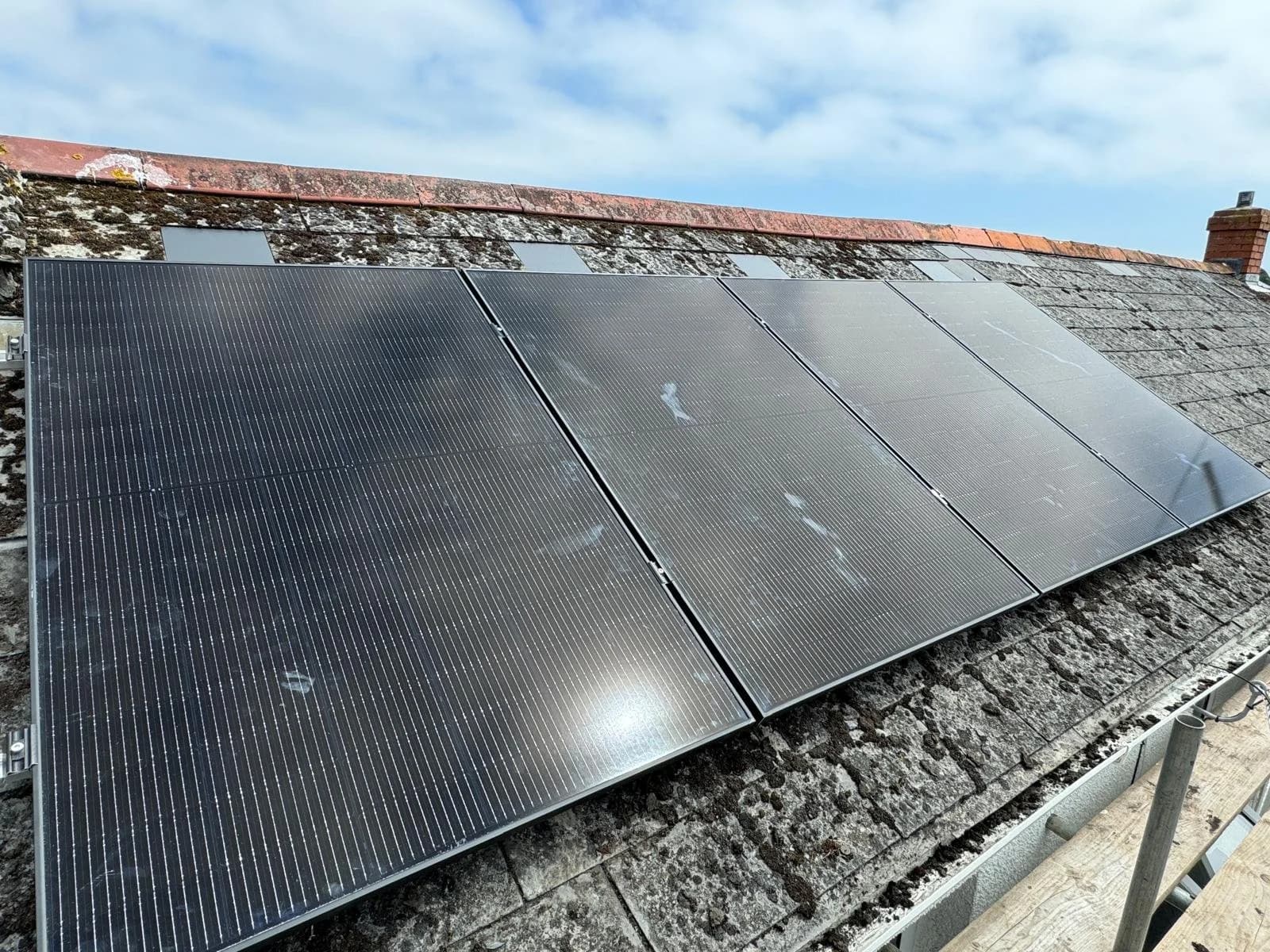 Close-up of the black solar panels on the slate roof in Clifden, St Austell