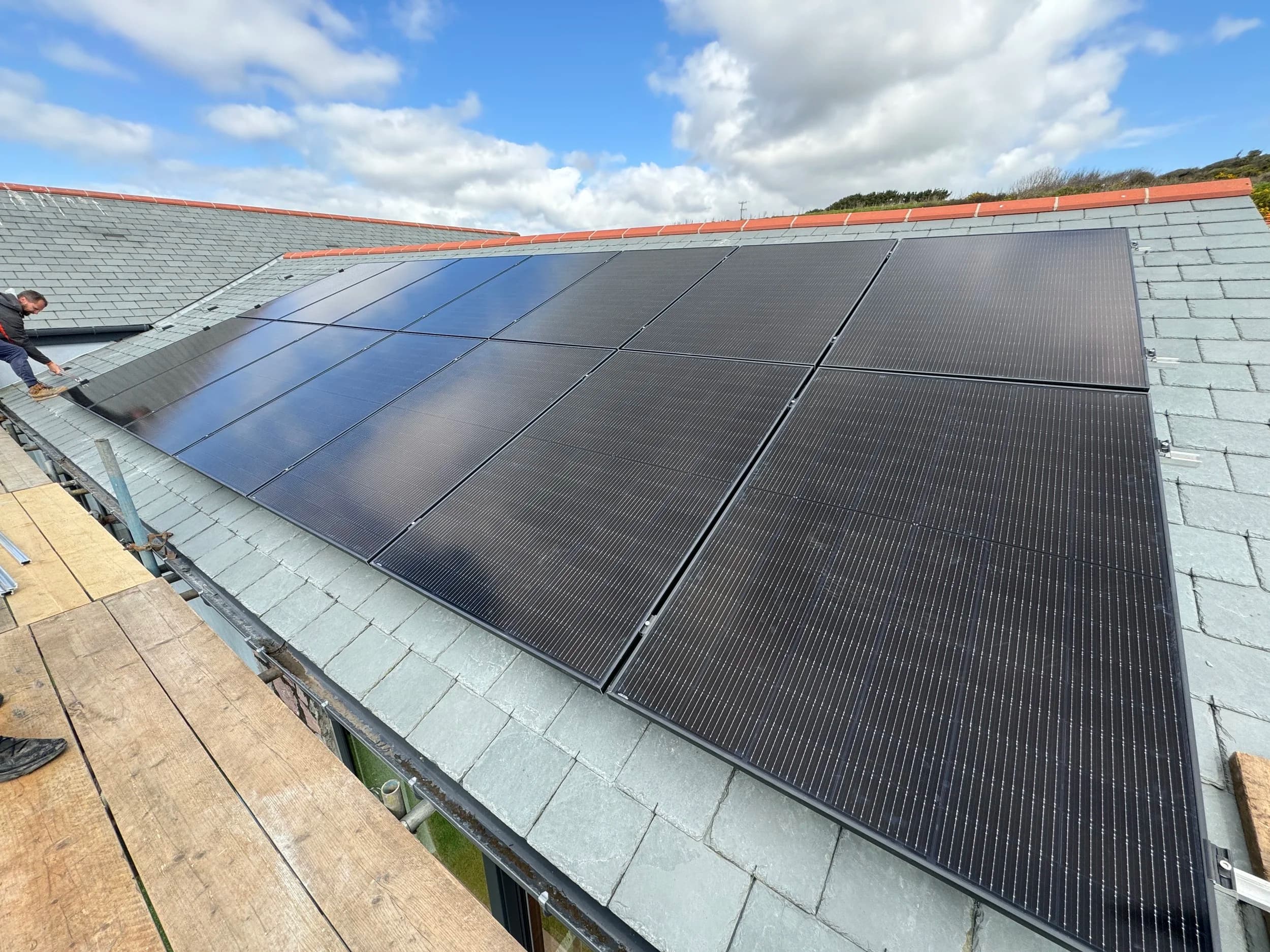 Black solar panels on the slate roof at Thanckes House, Polbathic