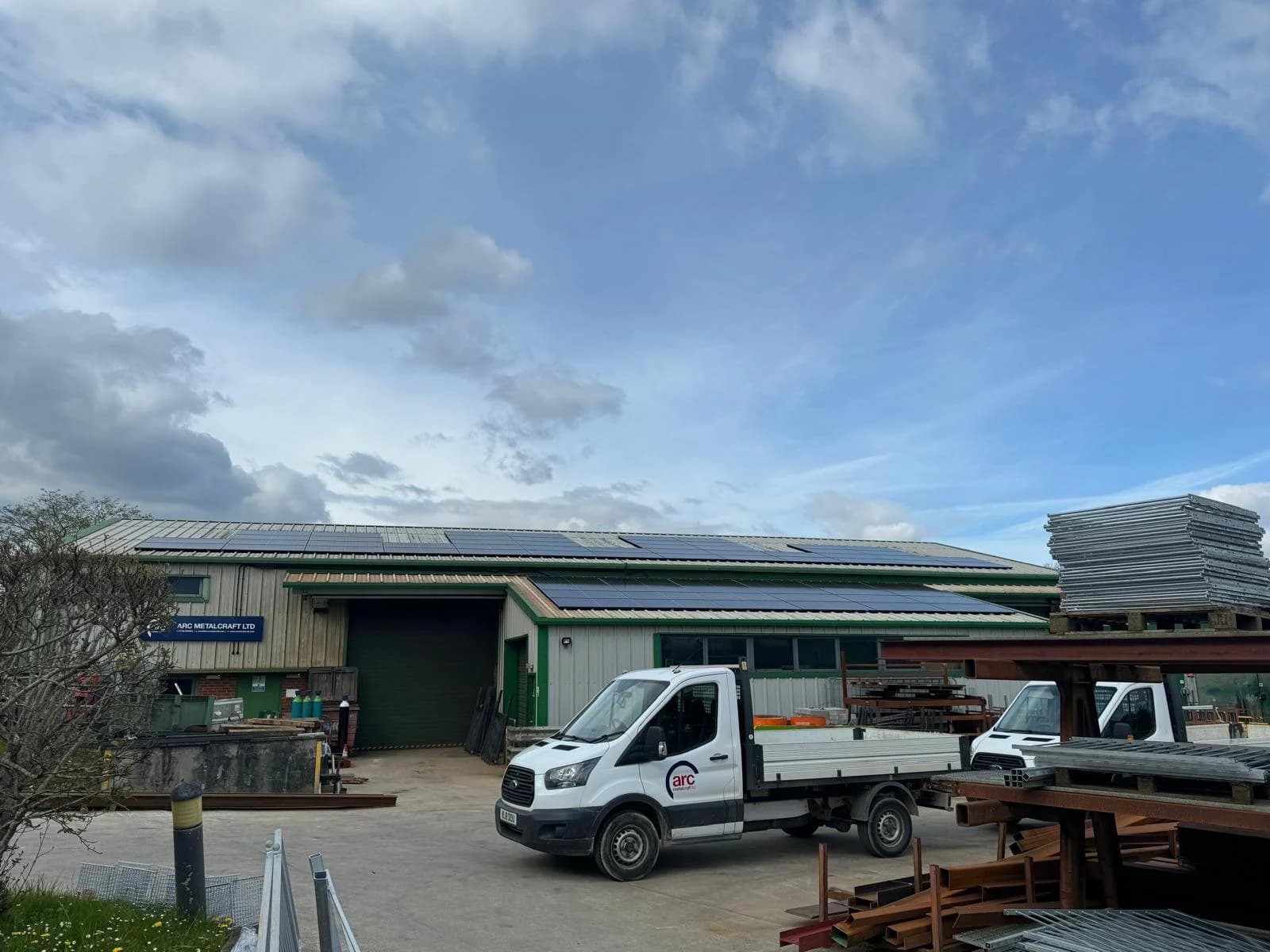 The Arc Metalcraft workshop and yard in Plymouth, with solar panels on the roof